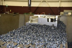 Metal shavings around new car part